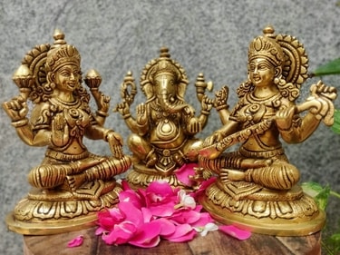 Ganesha and Laxmi's painted and ornate idols are ideal gift for wishing a loved one happiness, money, and success in life. (pinterest) Ganesha and Laxmi's painted and ornate idols are ideal gift for wishing a loved one happiness, money, and success in life. (pinterest)