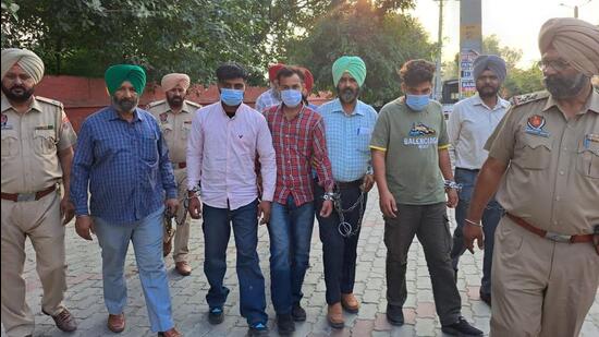 The trio -- Balraj Singh of Bhikhiwind, Atish Kumar and Avinash Kumar of Sarhali village in Tarn Taran -- were nabbed with an AK-47 rifle, three pistols and 55 rounds of ammunition during a joint operation of Delhi Police, Punjab anti-gangster task force (AGTF) and the Amritsar police commissionerate on Friday. (HT Photo)