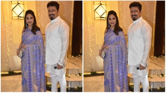 Madhuri Dixit arrived with her husband Dr. Nene. The 'Dhak Dhak' girl draped a lavender saree while Dr. Nene complemented his wife in an all white kurta set. (HT Photo/Naziyah Khan)
