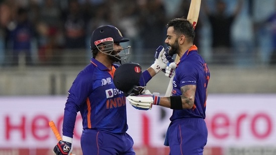 India's Virat Kohli, right, celebrates with batting partner Rishabh Pant (AP)