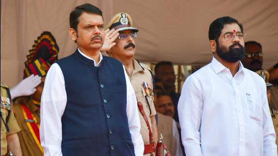 Maharashtra chief minister Eknath Shinde with deputy chief minister Devendra Fadnavis during Police Commemoration Day, at police headquarters in Mumbai on Friday (PTI)
