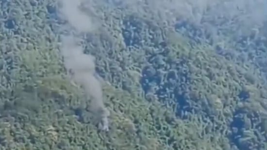 Smoke billows from site where military helicopter crashed in Upper Siang district of Arunachal Pradesh on Friday.