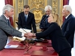 Giorgia Meloni: Italy's new Minister of Sports and Youth Andrea Abodi shakes hands with Italy's new Prime Minister Giorgia Meloni.