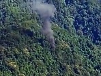 Smoke seen coming out from the accident site where an Advanced Light Helicopter (ALH) military chopper crashed near the Tuting area in the Upper Siang district of Arunachal Pradesh on Friday. (ANI) Smoke seen coming out from the accident site where an Advanced Light Helicopter (ALH) military chopper crashed near the Tuting area in the Upper Siang district of Arunachal Pradesh on Friday. (ANI)