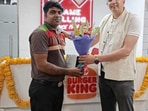 Burger Kind employee.(Instagram/@BurgerKingIndia) Burger Kind employee.(Instagram/@BurgerKingIndia)