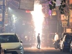 People burning firecrackers on Diwali in Pandav Nagar in New Delhi.(Raj K Raj/HT PHOTO) People burning firecrackers on Diwali in Pandav Nagar in New Delhi.(Raj K Raj/HT PHOTO)