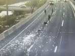 Screengrab of the video showing money money fallen on the highway in Chile.(Skynews) Screengrab of the video showing money money fallen on the highway in Chile.(Skynews)