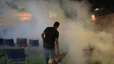 A municipal worker takes part in a fogging drive in Gurugram. (HT)