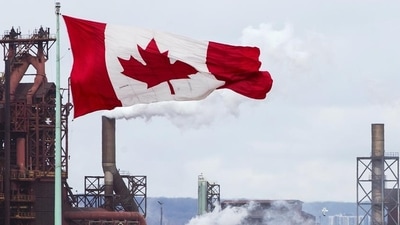 Canada Express Entry System: A Canada flag flies in Hamilton, Ontario. Canada Express Entry System: A Canada flag flies in Hamilton, Ontario.