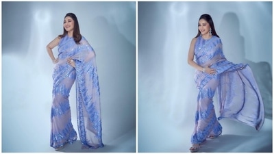 Madhuri Dixit is the ultimate 'dhak dhak' girl and her stylish appearances on shows and events speak volumes. For Manish Malhotra's Diwali bash, the timeless beauty draped a blue sequin 9-yards from the collection the designer's collection. (Instagram/@madhuridixtnene) Madhuri Dixit is the ultimate 'dhak dhak' girl and her stylish appearances on shows and events speak volumes. For Manish Malhotra's Diwali bash, the timeless beauty draped a blue sequin 9-yards from the collection the designer's collection. (Instagram/@madhuridixtnene)