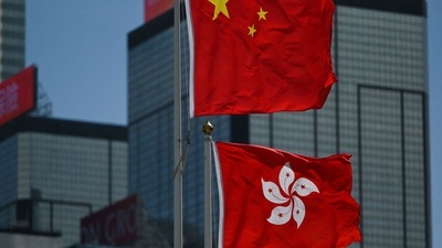 Hong Kong and China flags fly in Hong Kong. (AFP) Hong Kong and China flags fly in Hong Kong. (AFP)