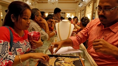 On this day, people purchase items made of brass, silver, and gold since this practice is believed to bring good fortune, success, and protection from the evil eye. (REUTERS)