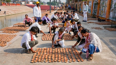 Children with hearing disability of Muskan Rehabilitation Centre arrange earthen lamps as part of preparations for Deepotsav in Ayodhya on Saturday, (PTI) Children with hearing disability of Muskan Rehabilitation Centre arrange earthen lamps as part of preparations for Deepotsav in Ayodhya on Saturday, (PTI)