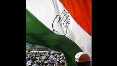 Congress supporters waving party flag. (File Photo) Congress supporters waving party flag. (File Photo)