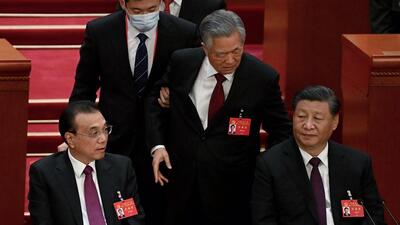 China’s President Xi Jinping (right) sits besides Premier Li Keqiang (left) as former president Hu Jintao (centre) is assisted to leave from the closing ceremony of the 20th China's Communist Party's Congress at the Great Hall of the People in Beijing on Saturday. (AFP) China’s President Xi Jinping (right) sits besides Premier Li Keqiang (left) as former president Hu Jintao (centre) is assisted to leave from the closing ceremony of the 20th China's Communist Party's Congress at the Great Hall of the People in Beijing on Saturday. (AFP)
