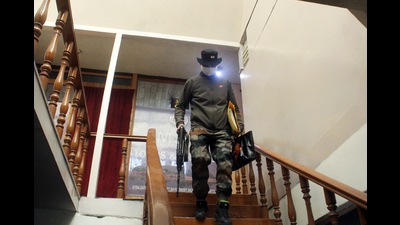 State Investigation Agency (SIA) of Jammu and Kashmir police during a raid in Srinagar on Saturday. (ANI)