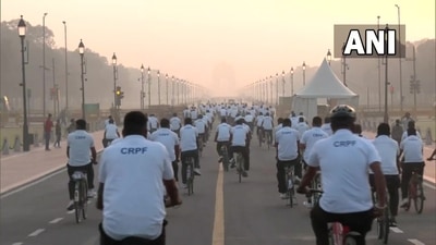 CRPF personnel can be seen cycling at Kartavya Path near India Gate. (ANI)