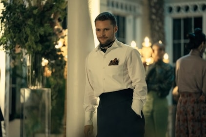 Jack Reynor plays Burton Fisher, a military veteran and Flynne’s brother. Jack Reynor plays Burton Fisher, a military veteran and Flynne’s brother.