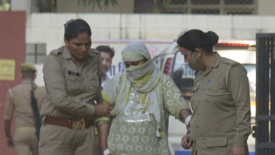 The woman accused of creating a fake kidnapping and rape case being produced in the Ghaziabad Police court. (Sakib Ali/HT Photo)