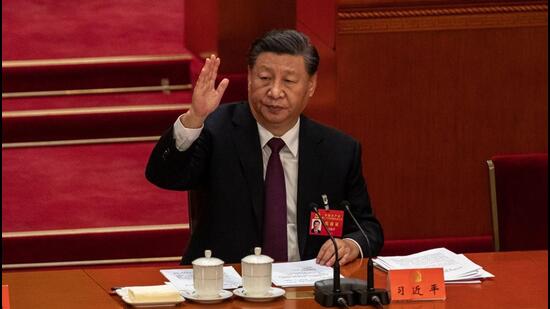 Xi Jinping, China’s president, raises his hand as he votes during the closing session of the 20th National Congress of the Chinese Communist Party at the Great Hall of the People in Beijing on Saturday. (Bloomberg)