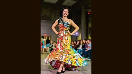 A model wears a dress made of snack wrappers at the 2018 MIT trashion show. (XI WU)