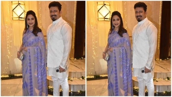 Madhuri Dixit arrived with her husband Dr. Nene. The 'Dhak Dhak' girl draped a lavender saree while Dr. Nene complemented his wife in an all white kurta set. (HT Photo/Naziyah Khan)