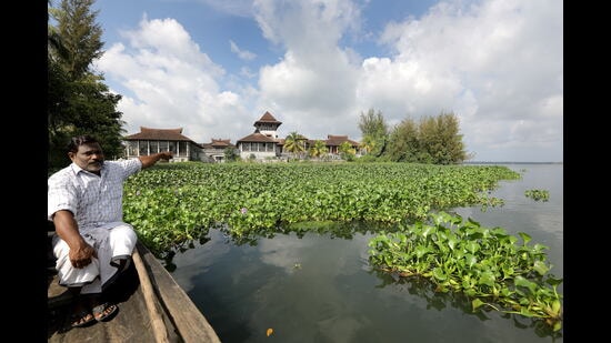 Sailan K, who filed a petition, points at Kapico Resort in the Vembanad in Kerala. (Vivek R Nair/ HT)