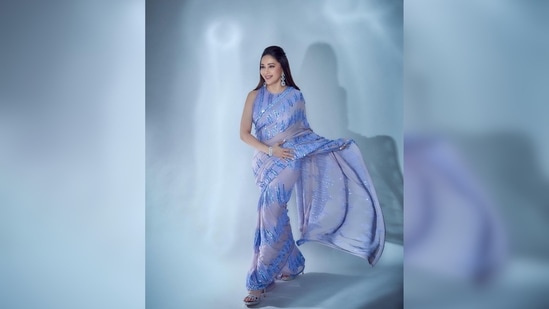 Madhuri Dixit accessorised her look with modern jewellery and dazzling stilettoes.(Instagram/@madhuridixitnene)