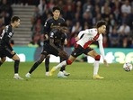 Southampton's Samuel Edozie, right, runs to take control of the ball during the English Premier League match(AP) Southampton's Samuel Edozie, right, runs to take control of the ball during the English Premier League match(AP)