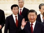 New Politburo Standing Committee members Xi Jinping, Li Qiang, Zhao Leji, Wang Huning, Cai Qi, Ding Xuexiang and Li Xi arrive to meet the media following the 20th National Congress of the Communist Party of China, at the Great Hall of the People in Beijing, 