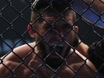 Islam Makhachev celebrates winning his fight against Charles Oliveira
