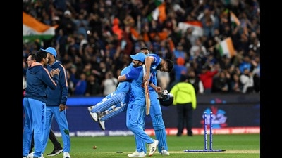 India captain Rohit Sharma lifts Virat Kohli as they celebrate after a win during the ICC men's Twenty20 World Cup 2022 match between India and Pakistan at Melbourne Cricket Ground (MCG) on Sunday. (AFP)