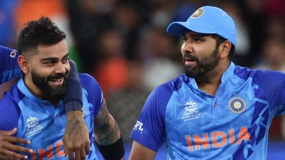 Virat Kohli, center, is escorted from the ground with teammates after winning their T20 World Cup cricket match against Pakistan (AP) Virat Kohli, center, is escorted from the ground with teammates after winning their T20 World Cup cricket match against Pakistan (AP)
