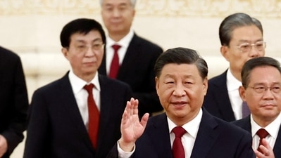 New Politburo Standing Committee members Xi Jinping, Li Qiang, Zhao Leji, Wang Huning, Cai Qi, Ding Xuexiang and Li Xi arrive to meet the media following the 20th National Congress of the Communist Party of China, at the Great Hall of the People in Beijing, (REUTERS)