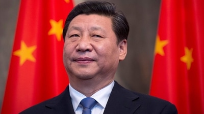Xi Jinping: China's President Xi Jinping stands by national flags. (AFP) Xi Jinping: China's President Xi Jinping stands by national flags. (AFP)