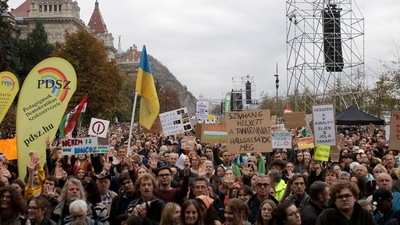 Hungary: People raise their placards and banners during a demonstration. (AFP) Hungary: People raise their placards and banners during a demonstration. (AFP)