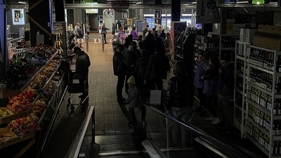 Russia-Ukraine War: People visit in a supermarket without electricity. (Reuters)