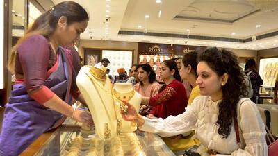 Women browsing through gold jewellery at a shop in Ludhiana on Sunday. (Gurpreet Singh/Hindustan Times) Women browsing through gold jewellery at a shop in Ludhiana on Sunday. (Gurpreet Singh/Hindustan Times)