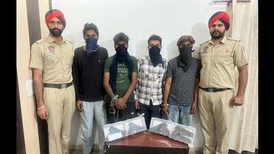 The four accused, including the two shooters who gunned down a shopkeeper in Tarn Taran on October 11, in police custody on Sunday. (HT Photo)