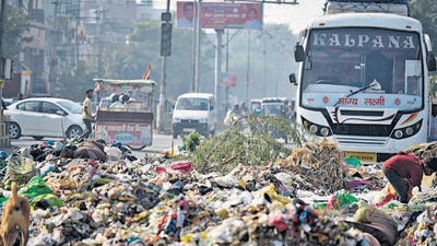 Gurugram, India-October 23: A road connecting sector-12 to Sheetla Mata mandir was blocked due to garbage as MCG employees are on strike since the last four days, in Gurugram, India, on Sunday, 23 October 2022. (Photo by Parveen Kumar/Hindustan Times)(Pic to go with Debashish Karmakar story) Gurugram, India-October 23: A road connecting sector-12 to Sheetla Mata mandir was blocked due to garbage as MCG employees are on strike since the last four days, in Gurugram, India, on Sunday, 23 October 2022. (Photo by Parveen Kumar/Hindustan Times)(Pic to go with Debashish Karmakar story)