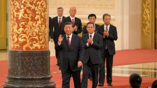Xi Jinping: China's President Xi Jinping walks with members of the Chinese Communist Party's new Politburo Standing Committee.(AFP)