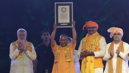 Uttar Pradesh CM Yogi Adityanath holds the 6th consecutive Guinness World Record certificate for lighting over 15 lakh lamps in Ayodhya.(Deepak Gupta/HT photo)