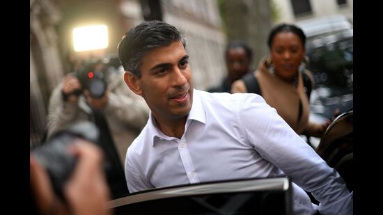 Britain’s former Chancellor of the Exchequer, Conservative MP, Rishi Sunak leaves from an office in central London. (AFP)
