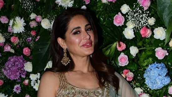 Nargis Fakhri made a rare appearance at Ekta Kapoor's Diwali party on Saturday. She was spotted in an olive green lehenga. She was last seen in Sanjay Dutt-starrer Torbaaz and is currently working on a Telugu film. (Varinder Chawla)