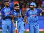 Virat Kohli, center, with teammates after winning their T20 World Cup cricket match against Pakistan.