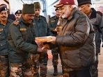 PM Modi exchanges sweets with security personnel in 2018. PM Modi exchanges sweets with security personnel in 2018.