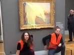 Climate protesters throw mashed potatoes at Monet's Les Meules painting. Watch