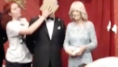 Just Stop Oil protesters throw custard pie at King Charles waxwork at Madame Tussauds.