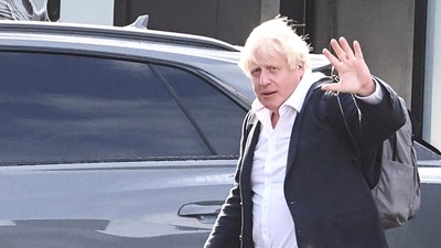 Former British Prime Minister Boris Johnson walks, at Gatwick Airport, near London, Britain. (Reuters)