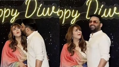 Kapil Sharma kissed his wife Ginni Chatrath at a Diwali party. Kapil Sharma kissed his wife Ginni Chatrath at a Diwali party.